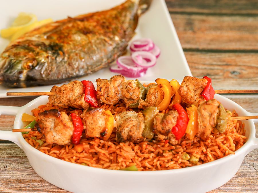 West African jollof rice with chicken skewers